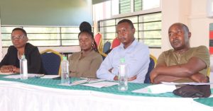 From left, Agnetta Nyalita, Gender Director, Elizabeth Mutinda Intern, Department of Gender, Children. Youth, Sports and Social Services at Makueni County, Harrison Musyoka, Makueni Youth Network and Anthony Munywoki Ndolo, C-Net(K) following keenly a discourse on the intersection of religion and SRHR.